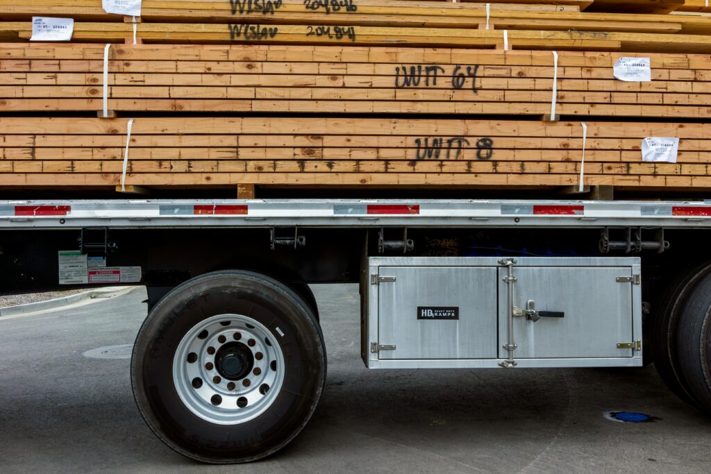 Freestone Transport hauling lumber on a flatbed trailer